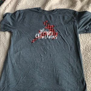 Red , black , white & grey rain deer shirt .